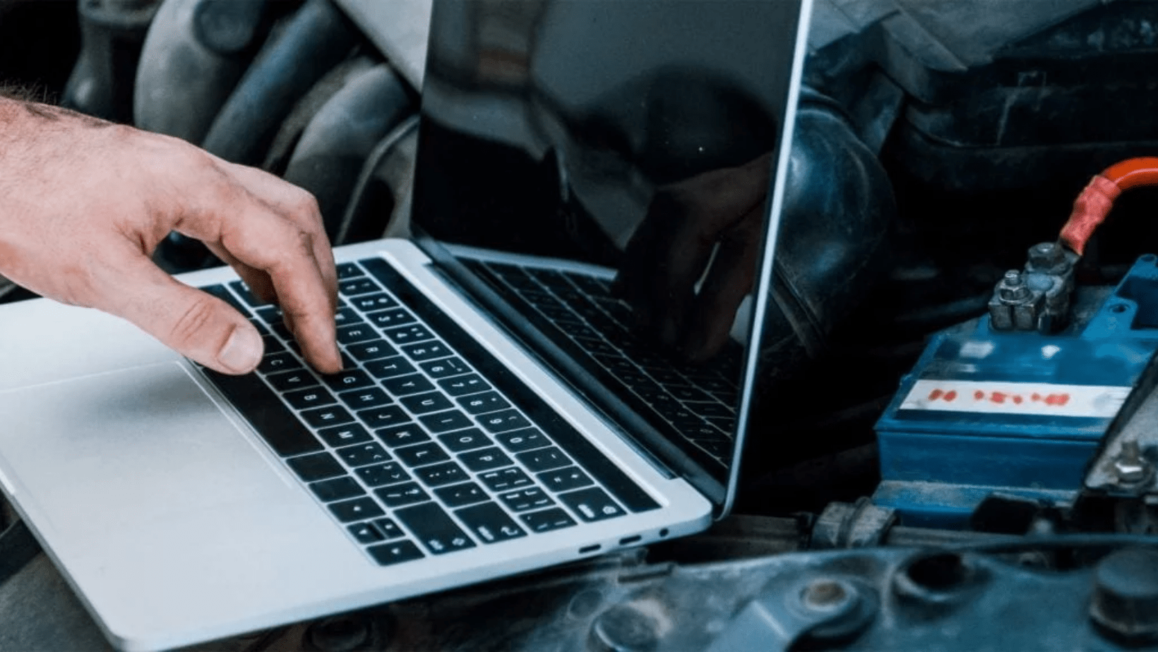 laptop on car engine